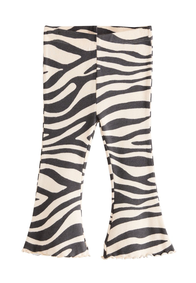 Zebrastribede, vidde leggings i ribstrik, med sort og cremefarvet mønster, bølget kant og tætsiddende talje.