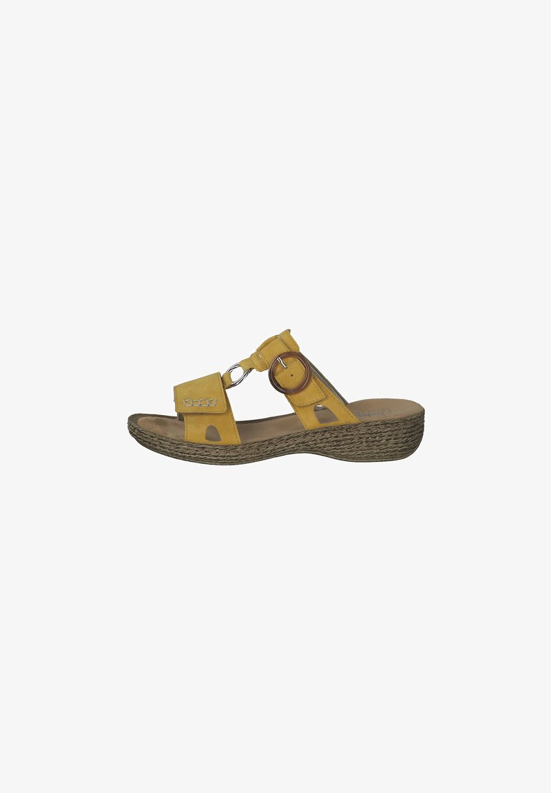 Yellow suede sandal with an open toe, two straps, a circular accent, and a textured wedge sole.