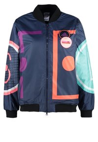 Navy blue bomber jacket with contrasting geometric patterns in purple, pink, and teal. Features ribbed collar, cuffs, and front zipper closure.