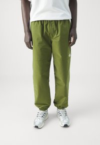 The North Face EASY WIND PANT - Treniņtērpa apakšdaļas - forest olive