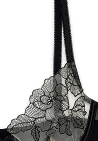 Sort blonde bralette med blomsterbroderi, der har indviklet detaljer, et gennemsigtigt panel og justerbare stropper. Blød tekstur og delikat design.