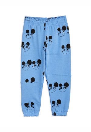 Joggers de algodón azul claro con un patrón repetido de caras de personajes de dibujos animados en negro. Cintura y puños elásticos con detalles de tela texturizada.