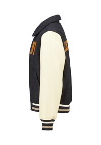 Black and beige varsity jacket with cream leather sleeves, ribbed cuffs and hem, and orange embroidered patches on chest and arm.