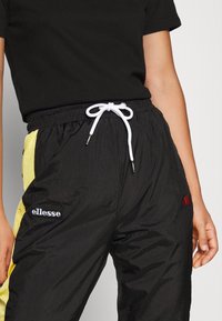 Ellesse Tracksuit bottoms - black