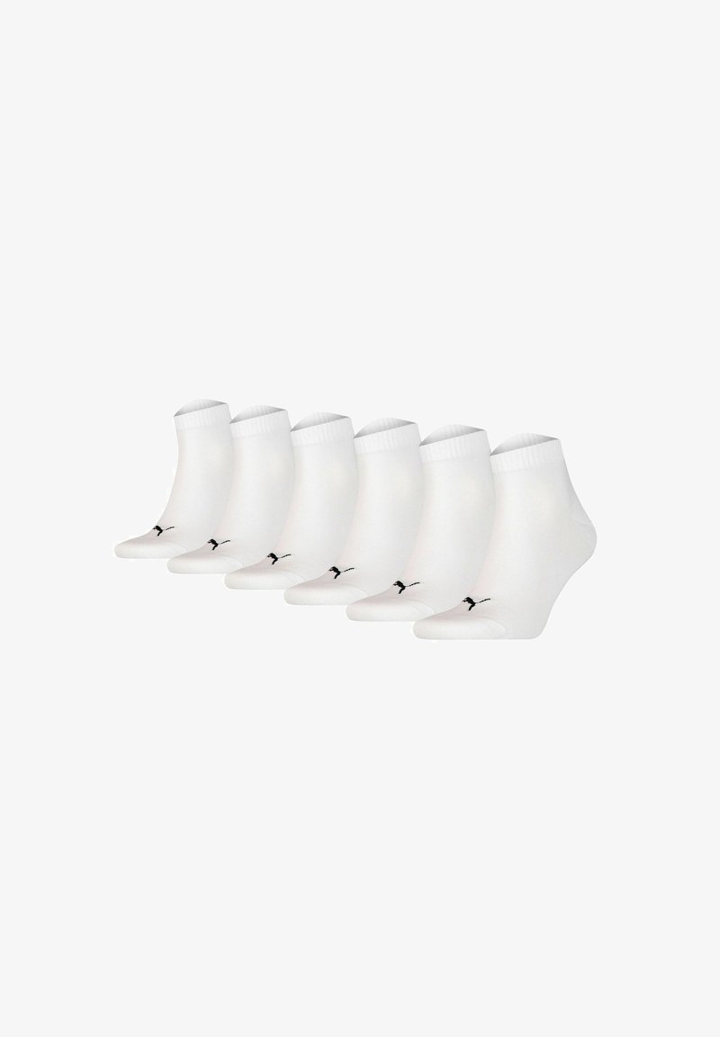 Six pairs of white ankle socks featuring a black logo, crafted from a smooth, stretchy material with a ribbed cuff for added comfort.