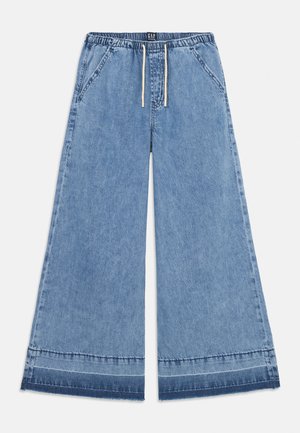 Svetlo modri denim široki hlače z elastičnim pasom in vrvico. Ima dve sprednji žep in rob z kontrastnim šivom.
