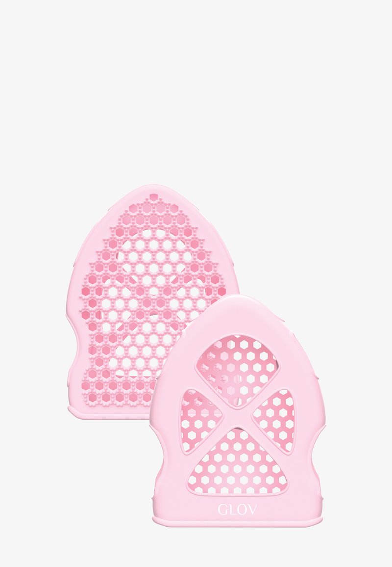 Gants de nettoyage en silicone rose avec une texture en nid d'abeille et des motifs découpés, présentant une finition lisse et un logo GLOV sur le côté.