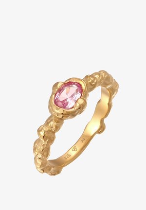 Goldring mit einem strukturierten, organischen Design, das einen ovalen rosa Edelstein in der Mitte zeigt. Der Ringband besticht durch seine einzigartige Formgebung und Detailverarbeitung.
