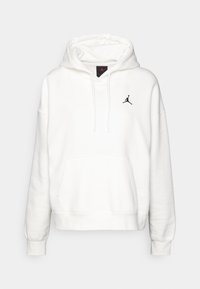 Sudadera blanca con un bolsillo frontal, capucha ajustable con cordones y un logo de Jumpman negro en el pecho. Fabricada con un tejido suave y texturizado.