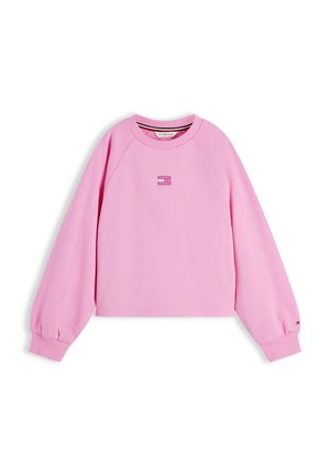 Sweat-shirt rose clair à manches longues avec col rond, poignets côtelés et petit écusson logo Tommy Hilfiger sur la poitrine et la manche.