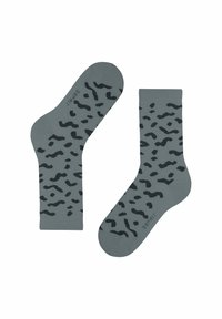 Grijze katoenen sokken met een zwart abstract patroon, voorzien van een geribde boord en een gladde textuur, ontworpen voor comfort en stijl.