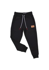 Schwarze Jogginghosen aus weichem Stoff, ausgestattet mit einem gerippten Bund, einem Zugband mit roten Akzenten und einem beigefarbenen Lederpatch an der Seite.