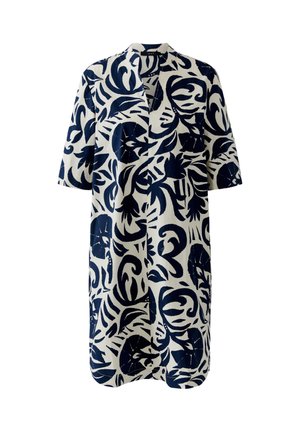 Witte jurk tot op de knie met marineblauwe tropische bladeren en abstracte patronen, korte mouwen, open voorkant en een kraag.