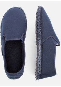 Navy canvas slip-on shoes with a textured rubber sole, a soft interior lining, and side elastic panels for easy wear.