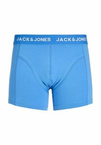 Boxer bleu homme avec une large ceinture élastique portant le nom de la marque « JACK & JONES » en texte blanc.
