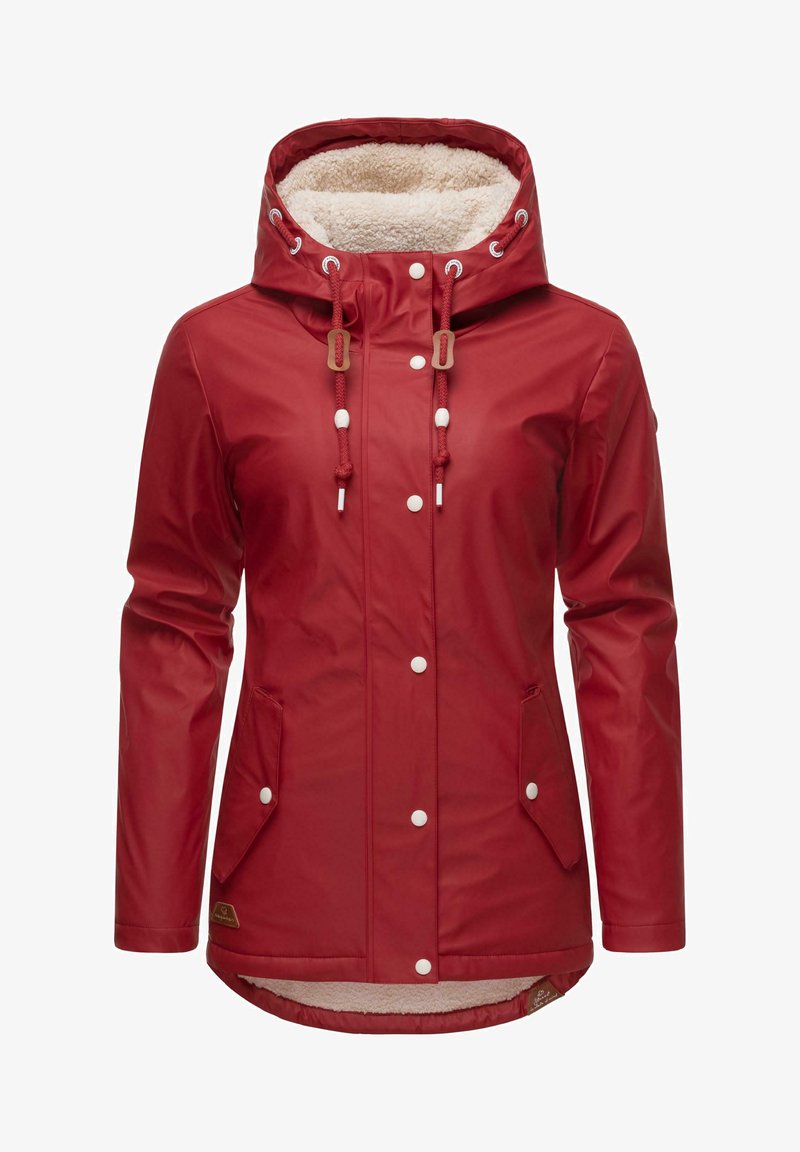 Red waterproof jacket with a soft fleece lining, adjustable hood, and white snap buttons. Features side pockets and a longer back hem.