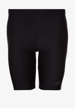 Schwarze eng anliegende Adidas Sportshorts mit hoher Taille und Logo am unteren linken Bein.