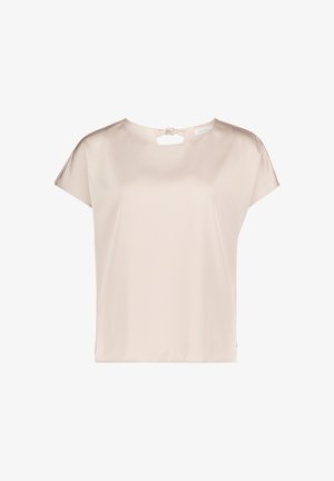 Beige kurzärmelige Bluse mit rundem Ausschnitt und kleinem Schlüsselloch-Detail, das hinten mit einer Schleife gebunden ist.