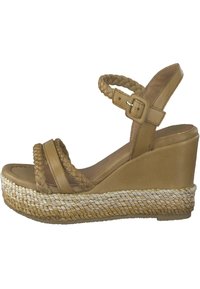 Sandalen aus braunem Leder mit Keilabsatz, geflochtenen Riemen, einer strukturierten Espadrilles-Plattform und einer Schnallenverschluss am Knöchel.