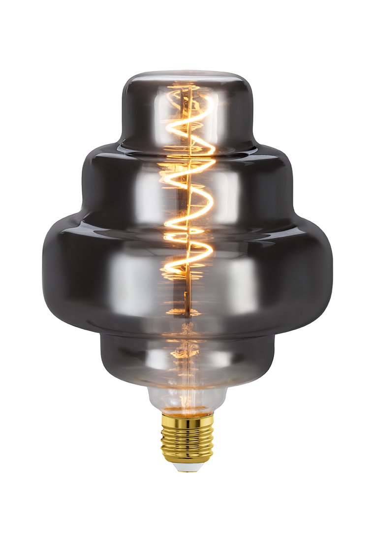 Klarer Glaslichtbulb mit einzigartiger wellenförmiger Form, dunkelgrauem Farbton, freiliegendem Filament und einem Messingfuß. Dekoratives und funktionales Design.