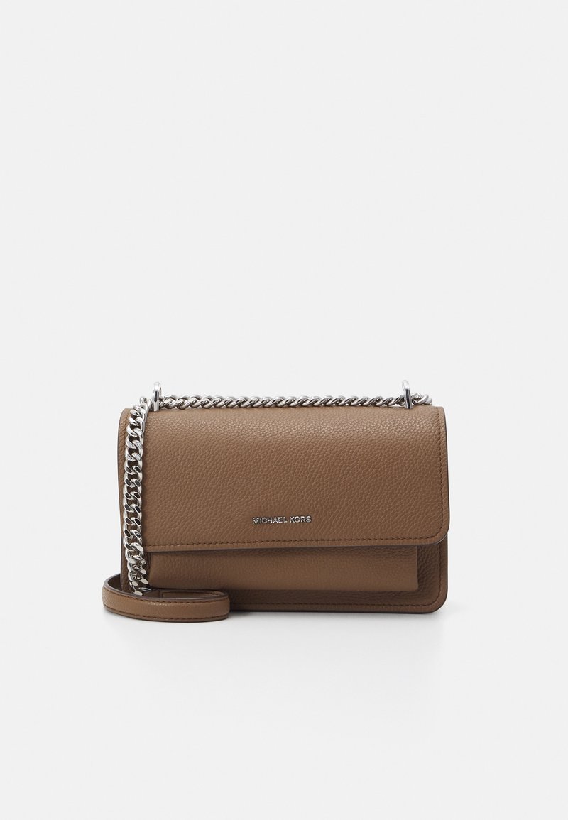 Brown leather crossbody bag with a textured finish, silver chain strap, and a flap closure. Features a branded logo on the front.