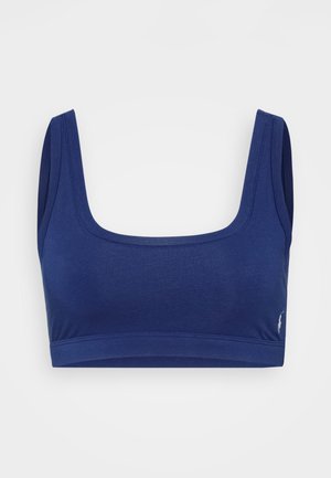 Top corto azul marino con tirantes anchos y escote cuadrado. Fabricado con una tela suave y un diseño ajustado y sin costuras. Acento de logo en la parte inferior.