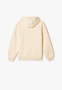 Sudadera crema con una textura suave, que cuenta con una capucha ajustable, puños y dobladillo acanalados. Corte boxy con hombros caídos.