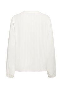 Blouse blanche à manches longues avec des rayures verticales discrètes, col rond et poignets élastiques, vue de dos.