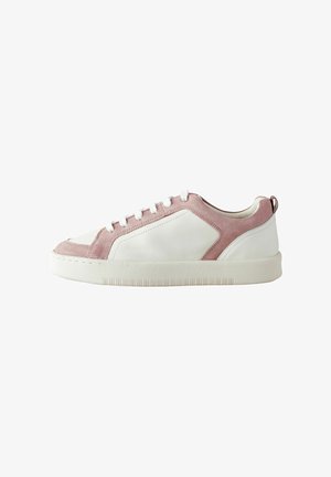 White leather sneaker with pink suede accents, featuring a rounded toe, six eyelets with white laces, and a textured rubber sole.
