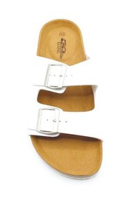 Sandale blanche avec deux boucles réglables, une semelle en liège et une semelle extérieure en caoutchouc texturé. Taille indiquée comme 42 à l'intérieur.