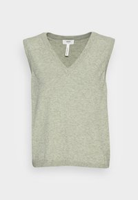 Haut sans manches vert clair avec un col en V. Confectionné en maille douce, présentant une texture côtelée le long de l'encolure et de l'ourlet.