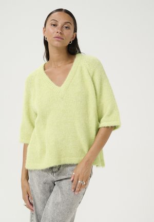 Hellgrüner, kurzärmeliger Pullover mit V-Ausschnitt, aus flauschigem Strickmaterial. Hat einen lockeren Schnitt und einen unvollendeten Saum.