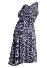 Maternity dress in deep navy featuring a geometric white pattern, V-neck, sleeveless design, and a loose A-line shape.
