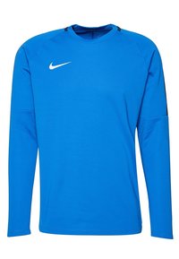 Långärmad blå Nike-tröja i strukturerad tyg, med rund halsringning och svarta detaljer på axlarna, samt en vit logotyp.