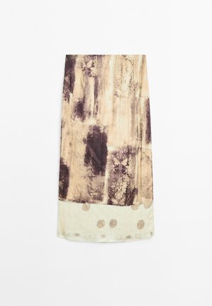 Lightweight fabric skirt featuring a beige base with abstract dark purple prints and circular gold accents at the hem.