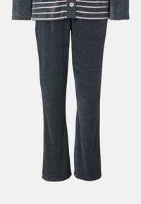 Grå bomullsoverallsbyxor med en avslappnad passform, som har en mjuk textur och något utsvängda ben, perfekta för komfort och avkoppling.