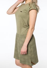 Olive green dress with short sleeves, featuring a solid top and a striped skirt, subtle side slits, and a brown accent on the hem.