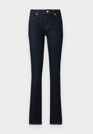 Tumedate sinised sirged teksad, valmistatud denimist, millel on oranž õmblus, ees nupuga sulgemine ja kaks tagataskut.