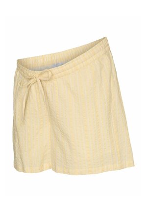 Lysegule teksturerede shorts med lodrette striber og elastisk talje, der er bundet i en sløjfe foran til venstre.