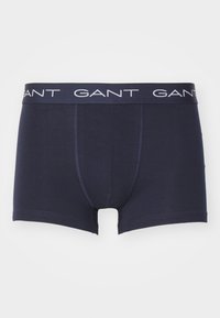 Boxer breves de algodón azul marino con un logo blanco de GANT en la cinturilla elástica. Presenta un diseño ajustado y costuras para la estructura.