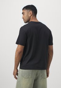 Puma BVB BORUSSIA DORTMUND FTBLCULTURE+ TEE - Sporto klubų atributika - black/shadow gray