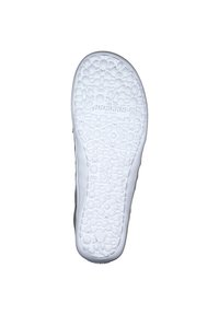 White shoe sole with textured floral pattern, featuring the brand name "Dockers" embossed. Smooth edges and curved shape, labeled size 42.