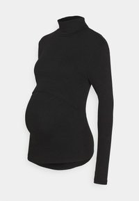 Svart graviditetsturtleneck i mjukt tyg med långa ärmar och kurvad sömdetalj, designad för att rymma en växande mage.