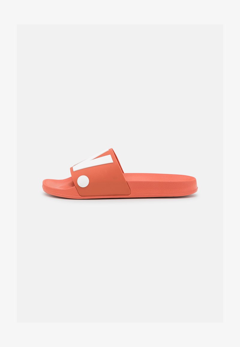 Coral slide sandal with a wide upper strap featuring a white accent. Smooth plastic material and flat sole. Lightweight design for easy wear.