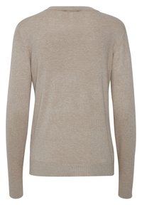 Beige neulepaita, jossa on pitkät hihat, pyöreä pääntie ja rento istuvuus. Tekstuuri on sileä, ja hihojen päissä on hienovaraiset ribbitekstuurit.