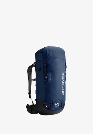 Sac à dos de randonnée en nylon bleu ayant une forme cylindrique, équipé d'un rabat supérieur, de sangles de compression latérales et d'une finition texturée. Taille : 40 litres.