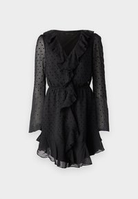 Vestido negro con lunares, con un escote en V rizado, mangas largas transparentes y una cintura elástica. El dobladillo presenta un detalle de volantes en capas.
