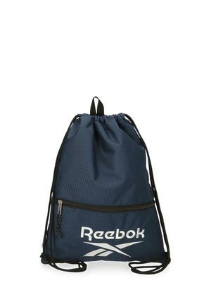 Bolsa de cordón azul marino con cordones negros, bolsillo frontal con cremallera y logo blanco de Reebok en la parte inferior delantera.