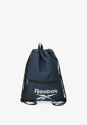 Bolsa de cordón azul marino con cordones negros, bolsillo frontal con cremallera y logo blanco de Reebok en la parte inferior delantera.