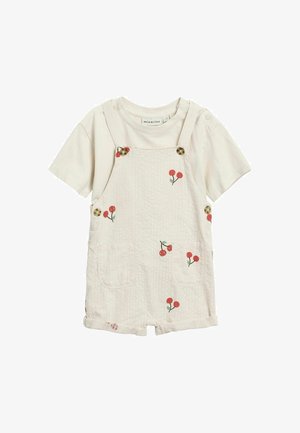 Cremefarvet romper til tumling med korte ærmer, knapstropper, forlommer og små røde kirsebærprint på stoffet.